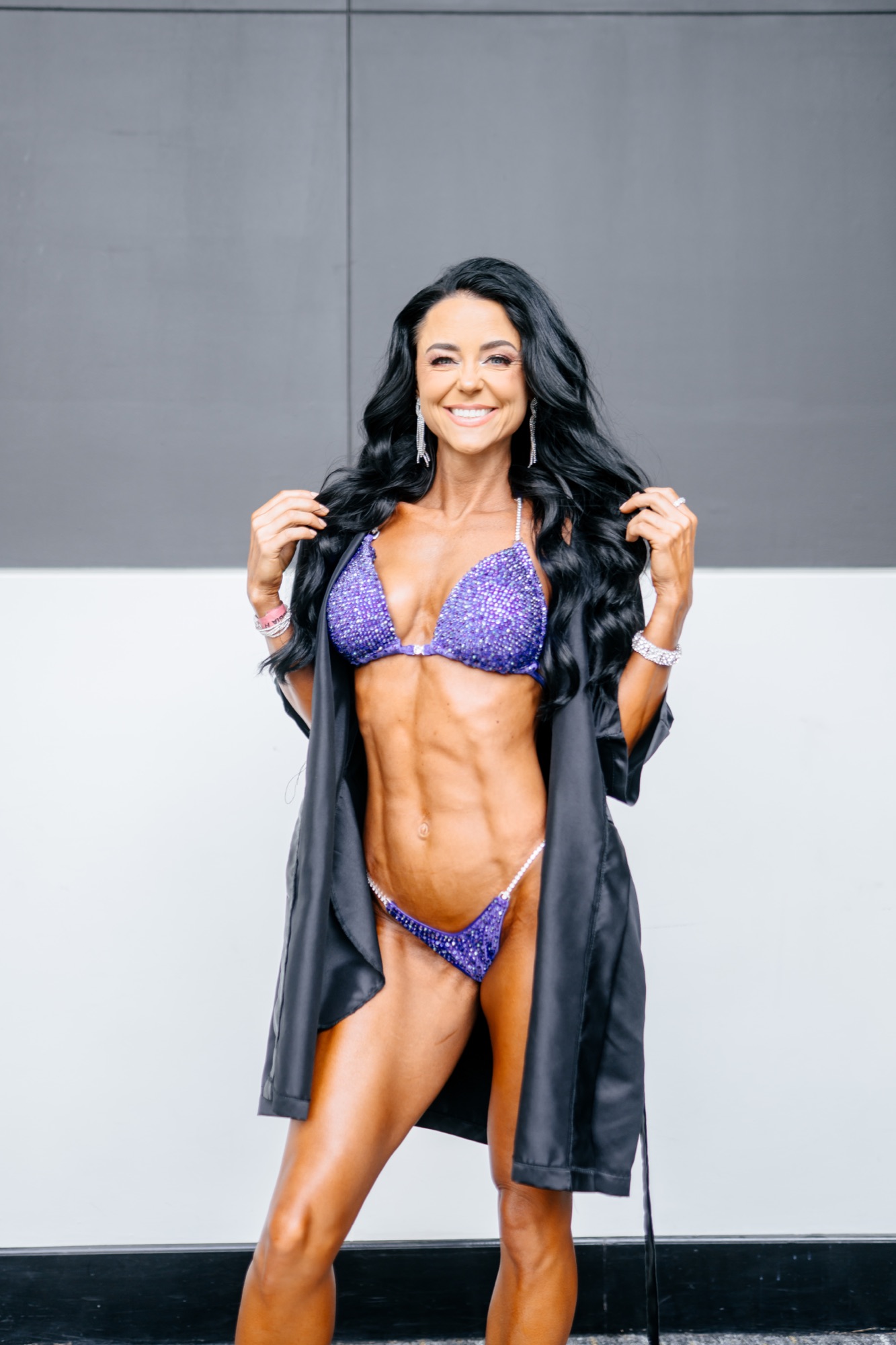 Courtney in her purple competition bikini and robe